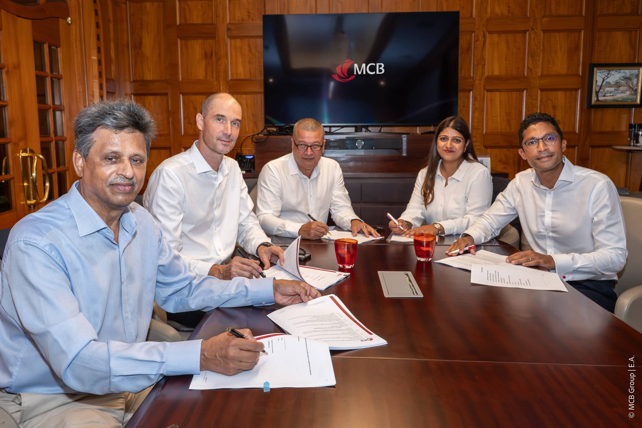 Kapildeo Joory (Benevolent Solar PV Farms), Olivier Gaering (Qair), Cyril Oudin (Qair), Diya Muttarooa (MCB) and Aldo Sydonie (MCB) signing a financing agreement for hybrid solar + BESS Stor'Sun III project