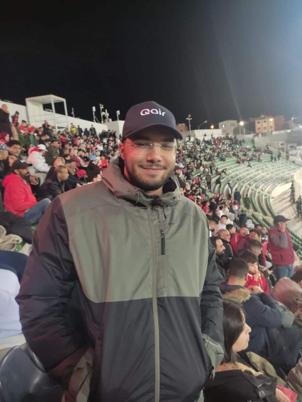 Qair employee at a football match